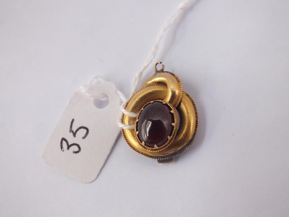 An antique garnet set drop (later attached metal oval on back) in 15ct gold - 2.8gms