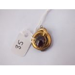 An antique garnet set drop (later attached metal oval on back) in 15ct gold - 2.8gms