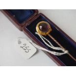 A good boxed cabochon garnet stick pin set in yellow metal