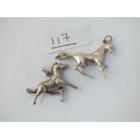 Two silver horse pendants