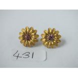 A pair of gold floral ear studs with ruby stones - 8gms