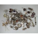 Thirty pairs of silver earrings