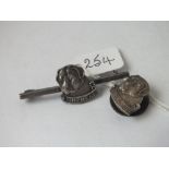 A silver bar brooch with dog motif together with silver lapel badge with dog motif both marked B.B.