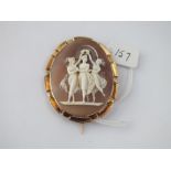 An oval cameo of 3 ladies dancing mounted in fancy gold frame