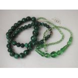 A graduated malachite bead necklace together with a green glass necklace