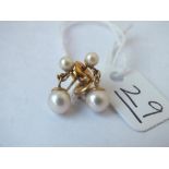 A pair of double pearl drop earrings in 9ct