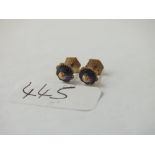 A pair of blue stone set ear studs