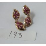 A pair of ruby double drop earrings in 9ct - 6.2gms