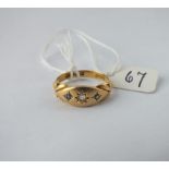 A diamond & sapphire gypsy set ring in 18ct gold - size M - 3gms