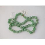 A green bead necklace