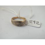 A hallmarked diamond set 3 row twist ring in 9ct - size N