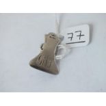 A small silver lapel badge/ clip