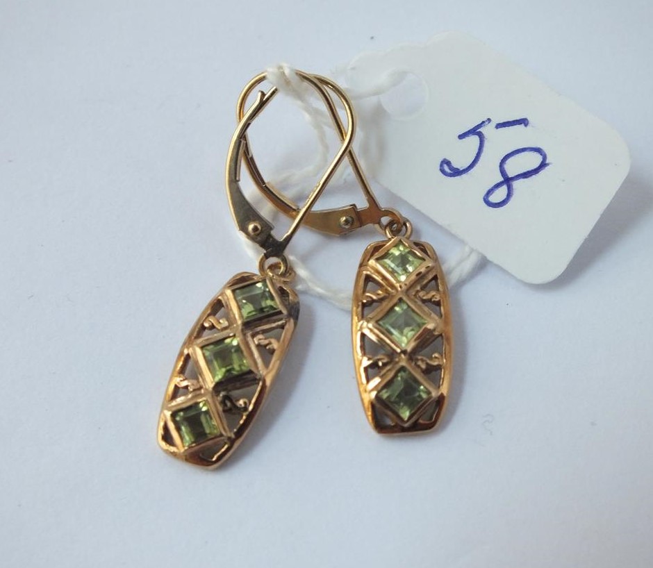 A pair of peridot drop earrings in 9ct