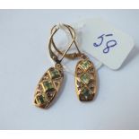 A pair of peridot drop earrings in 9ct