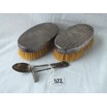 An art deco style spoon and pusher - Sheffield 1943/5 and two hairbrushes