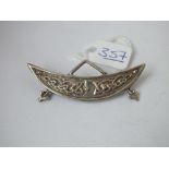 A silver Celtic style crescent brooch