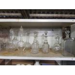 SHELF OF MISC GLASS DECANTERS