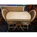 LIGHT COLOURED DROP FLAP KITCHEN TABLE WITH 2 MATCHING SPINDLE BACK CHAIRS