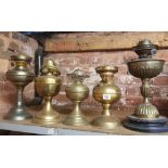 5 BRASS OIL LAMPS, 1 WITH AN ENGLISH JUNO FLAME ADJUSTER - ALL A/F