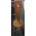 A CARVED HIGH BACK STOOL