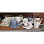 2 SHELVES OF MIXED GLASS WARE INCL: DECANTERS, VASES, DINNER PLATES BY COUNTRY LANE, BLUE & WHITE BY