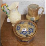 CLARICE CLIFF WATER JUG A/F , A POTTERY WATER JUG & A POTTERY POT WITH LID