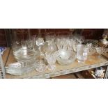 SHELF WITH QTY OF GLASS DECANTERS, FRUIT BOWLS, JUGS, WINE GLASSES & A PAIR OF GLASS CANDLE STICKS