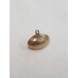 A 9ct RUGBY BALL CHARM