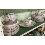 SHELF OF ROYAL DOULTON BURGUNDY PATTERNED DINNER WARE