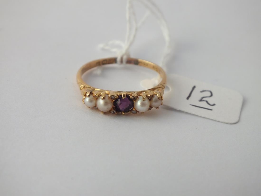 A five stone pearl and garnet ring in 18 ct gold - Size R - 2.8gms.