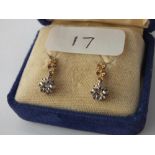 A boxed pair of diamond drop earrings in 9 ct