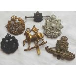 Five cap badges and regimental brooch