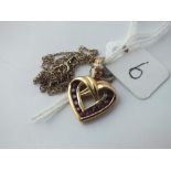 A heart shaped pendant on fine neck chain set in gold - 4.6gms