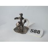 A miniature figure banging a drum, 1.25" high. Unmarked
