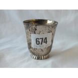 An Art Deco style beaker on rim foot, 2.25" high. London 1957 by WW 46gms.