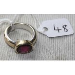An unusual gold & silver 1960's ring set with an oval almandine garnet - size M - 7.8gms