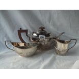 An oval half fluted tea set with leaf capped handles. B'ham 1975 by JC ltd. 800gms. all in