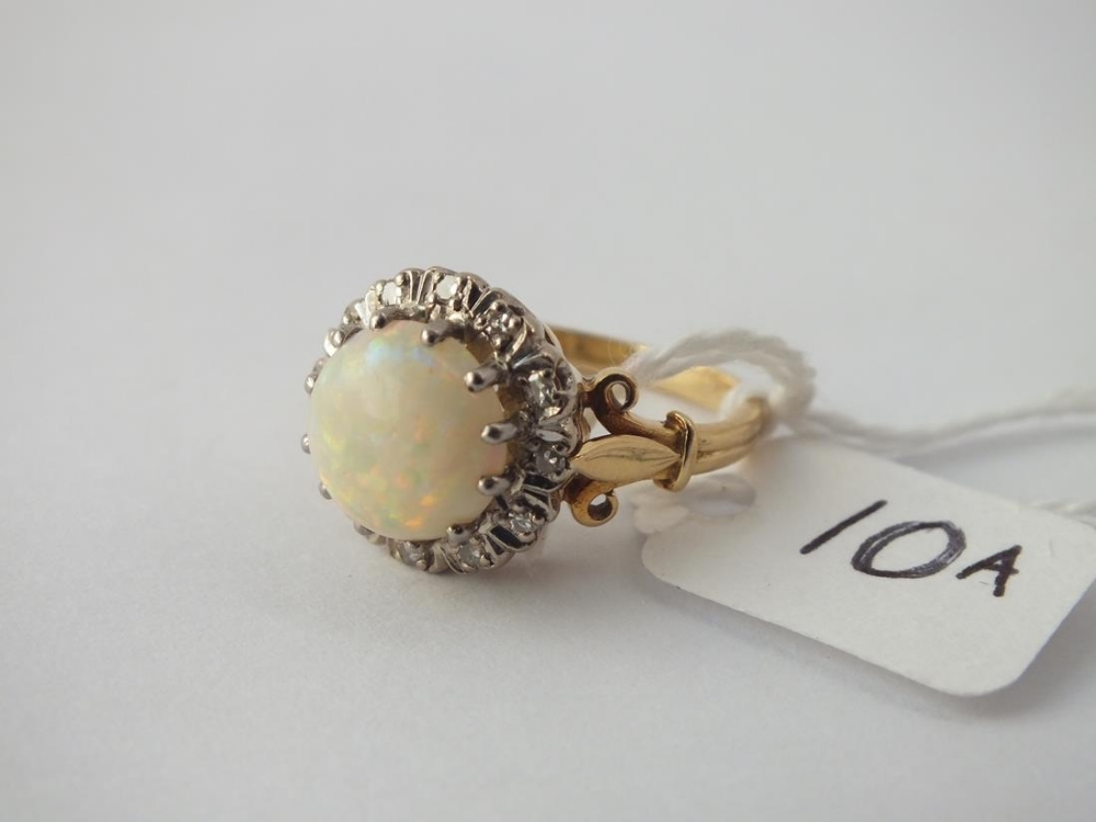 A LARGE OPAL AND DIAMOND CLUSTER RING in 18 ct gold - Size P - 6gms