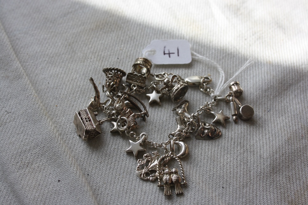 A silver charm bracelet - 28gms