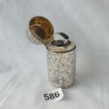 A silver encased salts bottle with stopper, stamped Sterling Silver by D & C