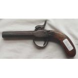 An antique percussion pistol
