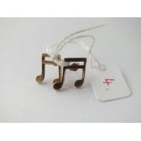 A pair of gold earrings in the form of music notes in 9 ct - 2.7gms