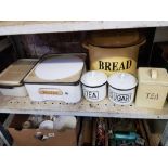 SHELF OF WHITE ENAMEL WARE INCLUDING TEA AND SUGAR CONTAINERS, AND OTHER ITEMS