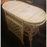 MODERN BAMBOO OVAL TABLE AND TWO CHAIRS WITH A SHELF IN IT