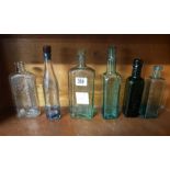 SHELF OF VINTAGE BOTTLES