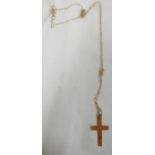 A SMALL 9CT CROSS ON FINE 9CT NECK CHAIN