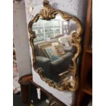 GILT FRAMED SHAPED MIRROR