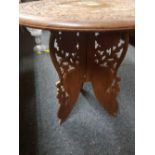 CARVED CIRCULAR TABLE WITH BONE INLAID ON A FOLDING BASE