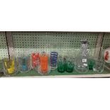 SHELF OF LEMONADE GLASSES, A DECANTER, ETC