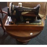 SINGER SEWING MACHINE IN AN OAK CASE